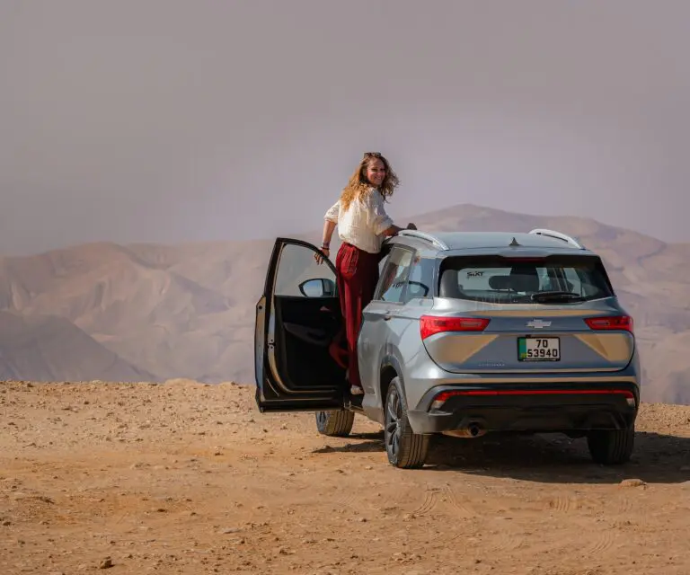 Car in front of canyon